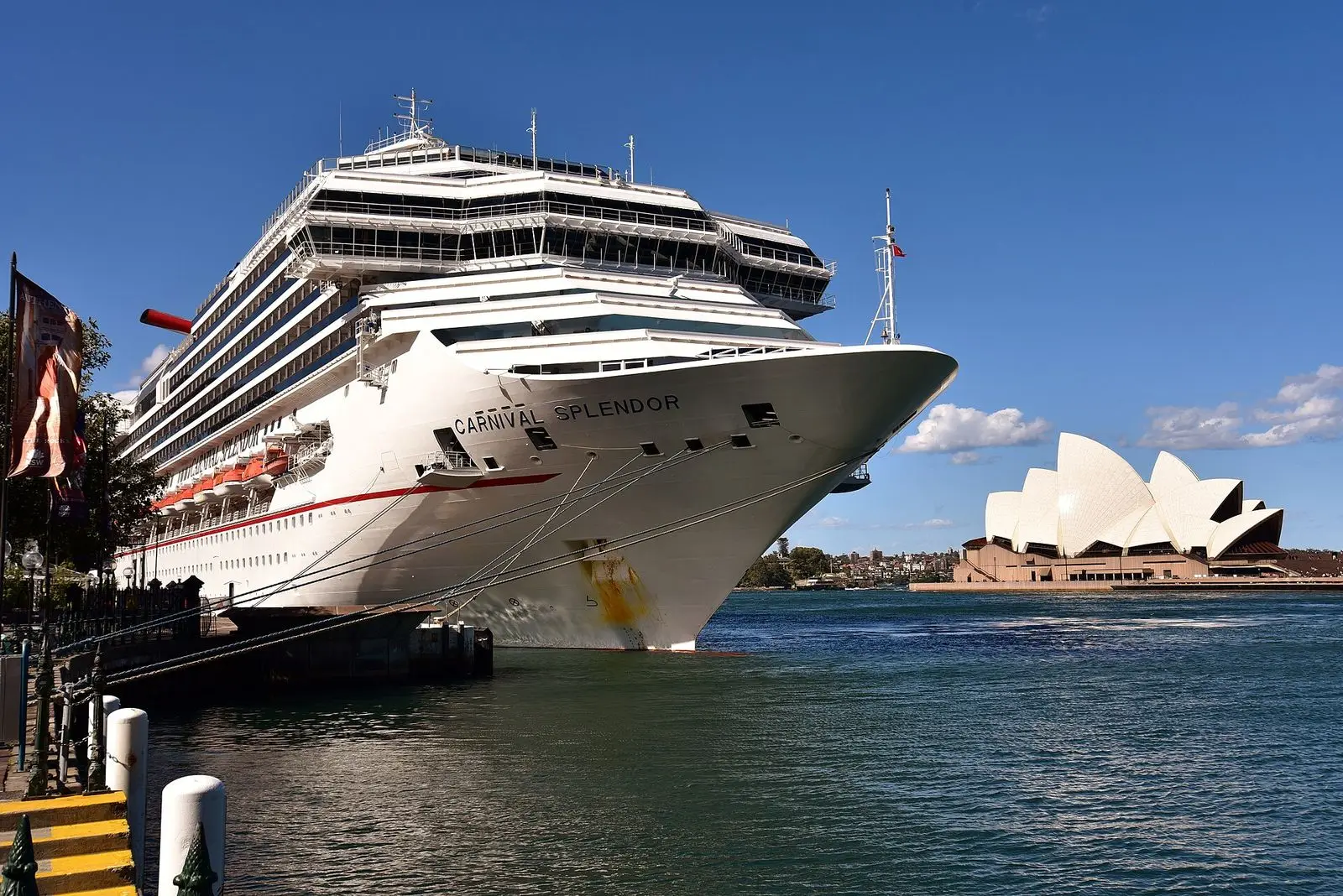 Carnival Splendor berthed at Circular Quay in Sydney Harbour, with the Sydney Opera House in the distance